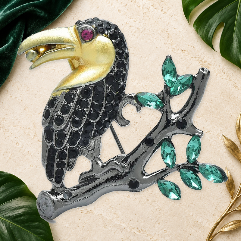 Jeweled Toucan on Leafy Branch Brooch on an elegant ivory, evergreen and gold tropical background