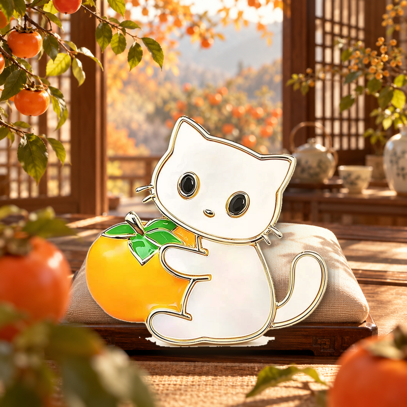 Little Cat Holding a Persimmon Brooch styled in a thematic scene