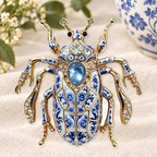 Ornate Patterned Scarab Beetle Brooch on a complementary display background
