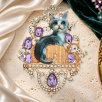 Ornate Rhinestone Cat Portrait Brooch on an elegant ivory, deep green and gold background