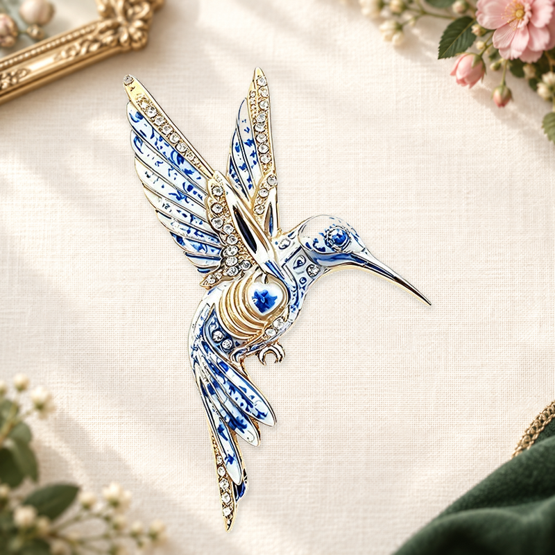 Patterned Hummingbird in Flight Brooch on an ivory themed backdrop