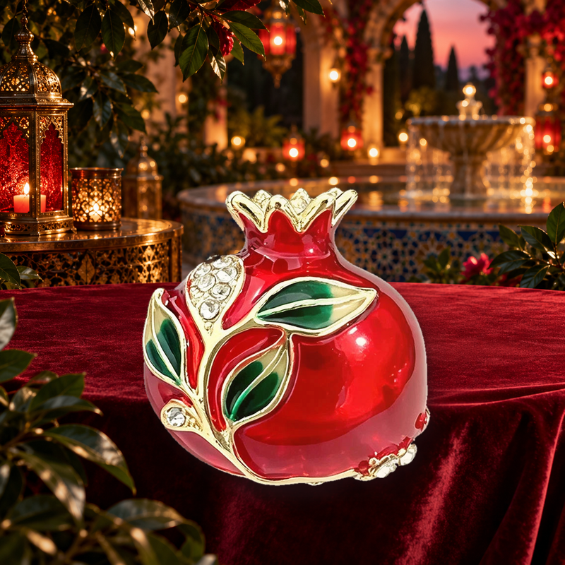 Red Pomegranate with Leaves Brooch styled in a thematic scene