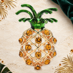 Rhinestone Pineapple with Enamel Leaves Brooch on an ivory, evergreen and gold gallery background