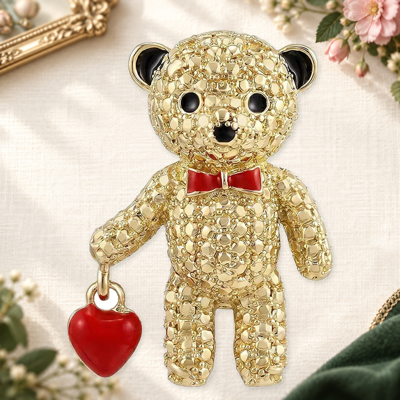 Sparkling Teddy Bear with Heart Charm Brooch on a complementary display background