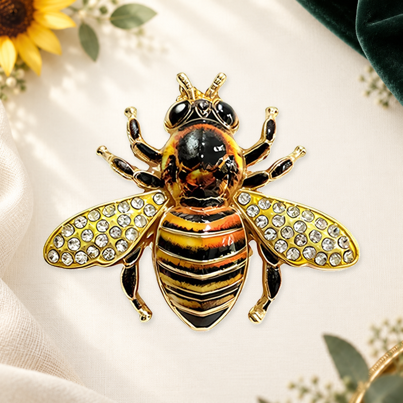 Striped Bee with Sparkling Wings Brooch on a complementary display background