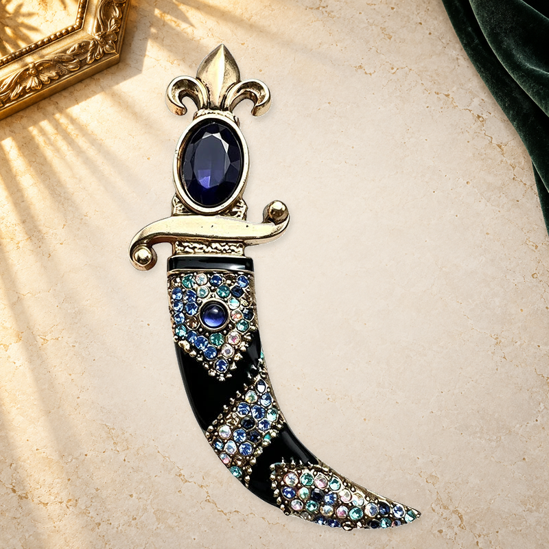 Vintage Curved Scimitar Sparkle Brooch on a complementary display background